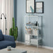 IKEA BAGGEBO white metal bookshelf styled in modern living room with books, decor and cactus beside it