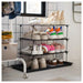 IKEA BAGGMUCK grey shoe mat 71x35cm in indoor setting near shoes and storage cabinet