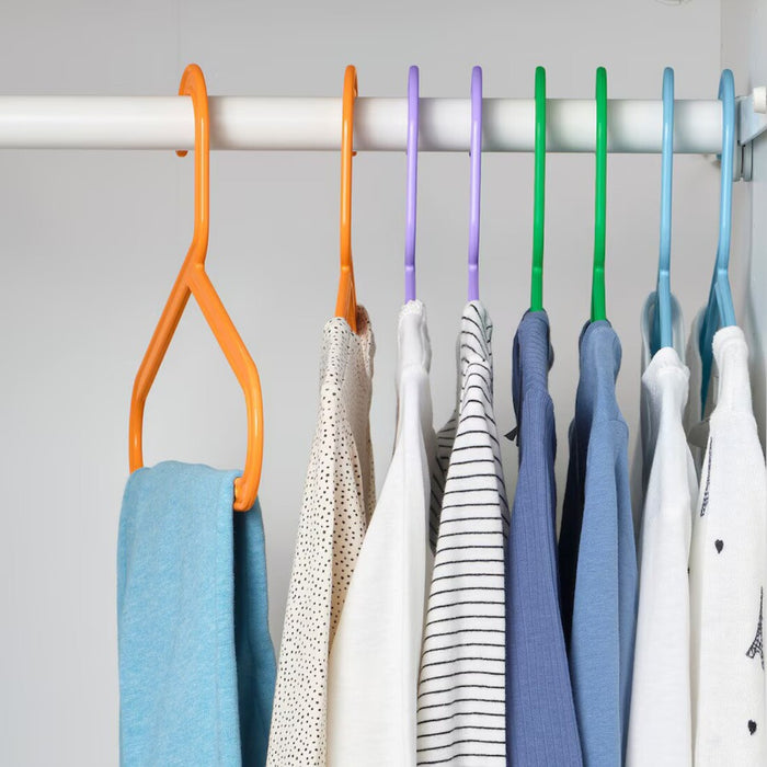 Close-up of colorful BAGIS children's hangers, lightweight and durable.