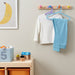 IKEA BAGIS coat-hangers in mixed colours, perfect for organizing kids' wardrobes.