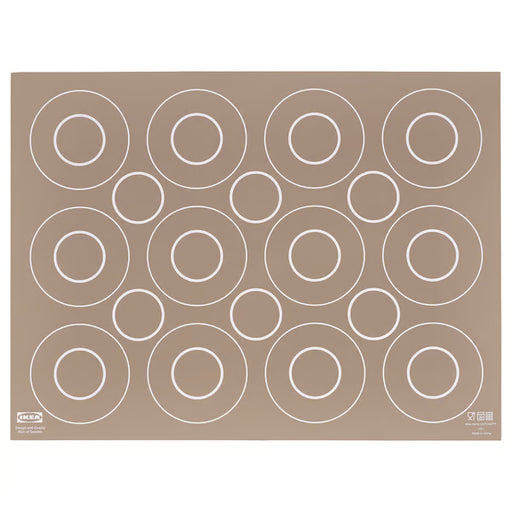 IKEA BAKTRADITION beige silicone baking mat 41x31cm with circular portion guides, flat lay on surface #50480177