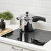  IKEA BANDGURAMI pressure cooker 5.5L placed on modern gas stove with kitchen accessories