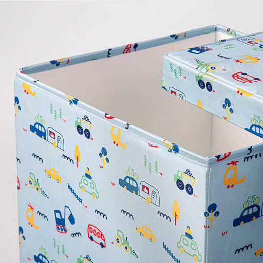 Close-up of IKEA BARNDRÖM fabric showing blue, yellow and green vehicle pattern