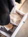  IKEA BAXNA grey white organiser inside open white dresser drawer with folded clothes and accessories
