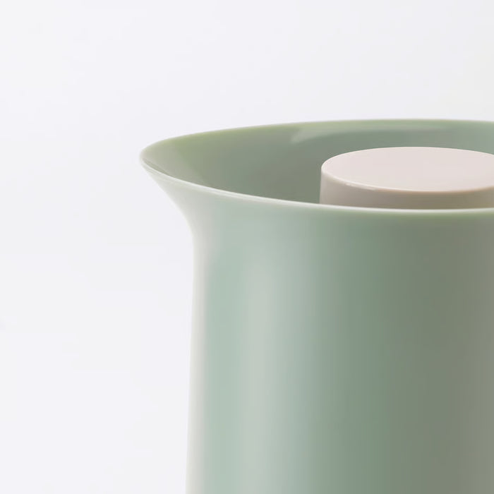 IKEA BEHÖVD light green vacuum flask close-up showing smooth finish and beige lid handle