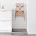  IKEA BEKVÄM beech step stool folded leaning against white tiled kitchen wall