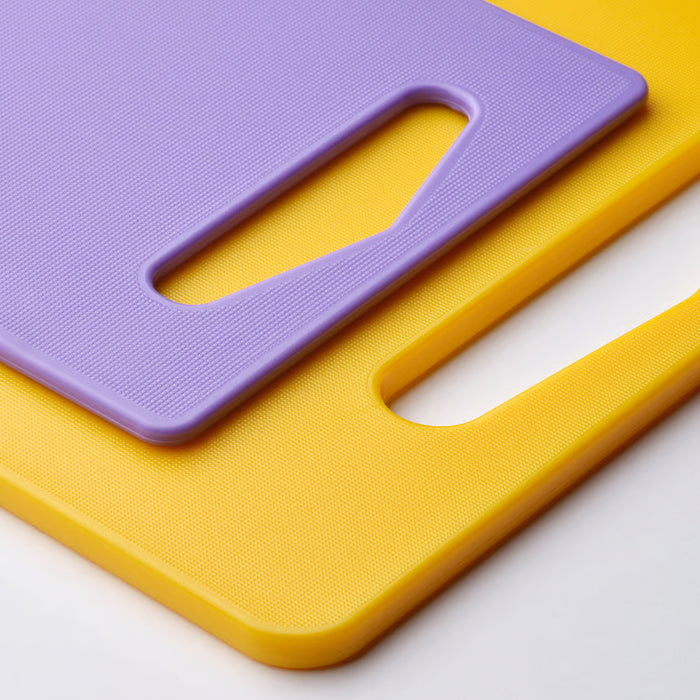 IKEA BERGTUNGA yellow and lilac chopping boards stacked showing durable plastic handles