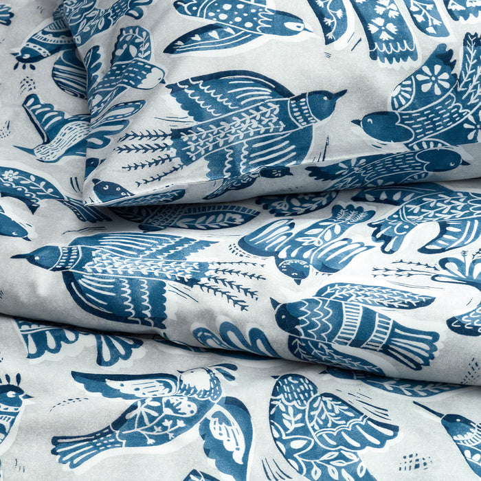 IKEA BITTERSÖTA duvet cover close-up, grey fabric with blue bird pattern detail