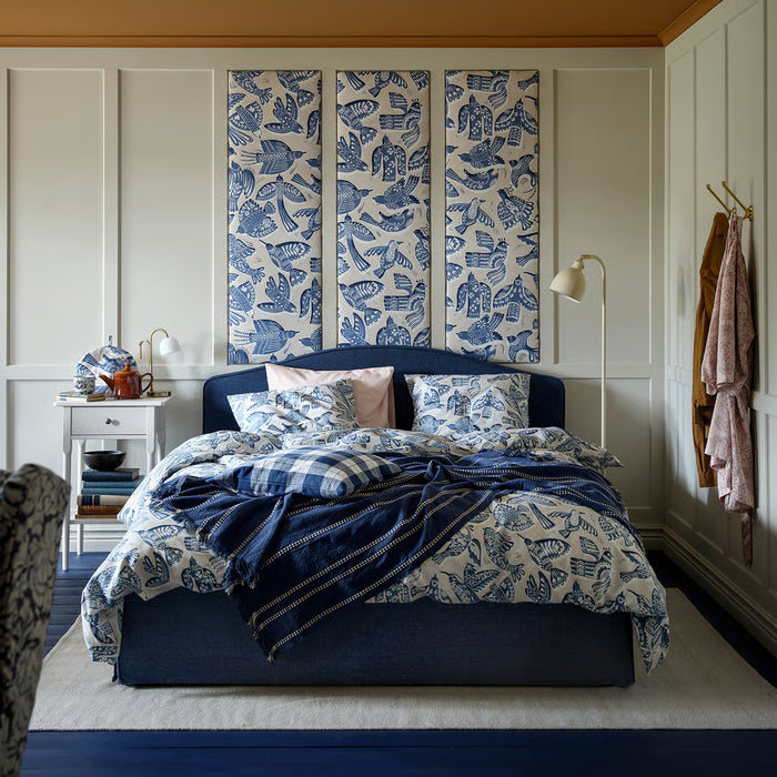 IKEA BITTERSÖTA duvet cover and pillowcase set styled on bed, blue bird design