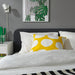 IKEA BLÅMUNKAR yellow dot cushion in modern bedroom styled with striped rug, tropical print and white lamp