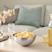 IKEA BLANDA BLANK stainless steel bowl with snacks on table with drinks and flowers