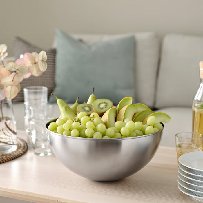 IKEA BLANDA BLANK stainless steel serving bowl filled with fresh green salad on a dining table