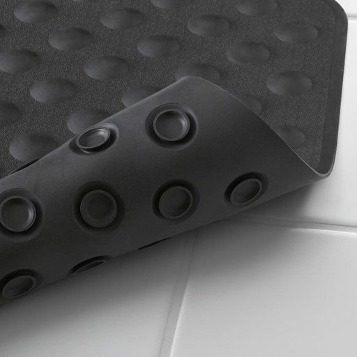  IKEA BLÅSJÖN grey anti-slip bath mat with suction cup base, close-up showing drainage and grip pattern