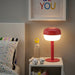Stylish IKEA 36 cm red table lamp on a side table
