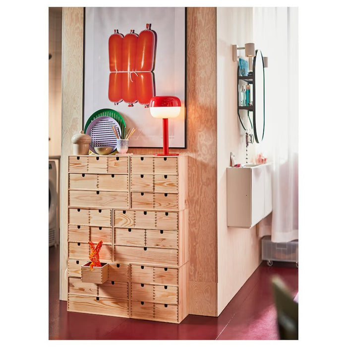 "IKEA's 36 cm red table lamp providing bright light for reading  