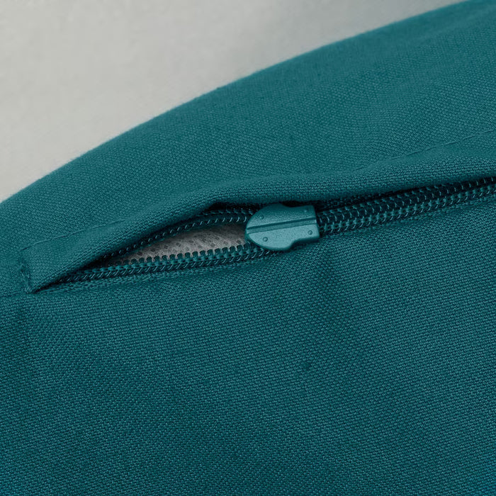 IKEA BLÅVINGAD cushion cover green side showing zip closure and recycled fabric texture
