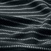 Close-up of IKEA BROKGINST black waffle-weave towel showing detailed cotton texture