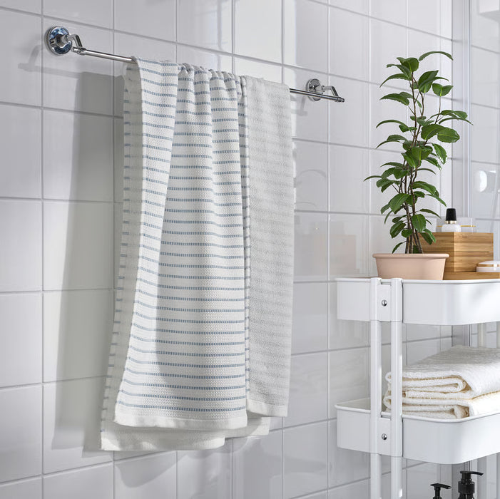  IKEA BROKGINST white bath towels hanging on hooks displaying both fabric textures