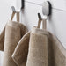  Close-up of IKEA BROKGLIM beige bath towel soft plush organic cotton texture and woven border