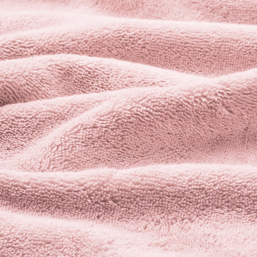 IKEA BROKGLIM pink bath towel lifestyle shot showing plush texture and soft colour
