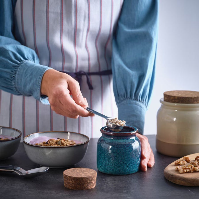 BRUGDHAJ 10oz blue jar shown next to measuring cup for size reference