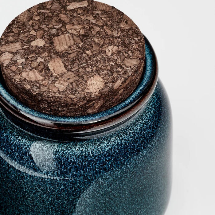 IKEA BRUGDHAJ blue jars organizing spices and dry goods on kitchen shelf, showing airtight storage solution