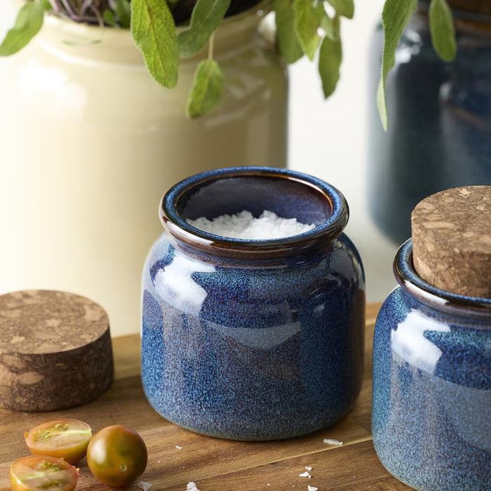 Close-up of BRUGDHAJ jar's blue tinted glass and secure snap-on plastic lid for freshness