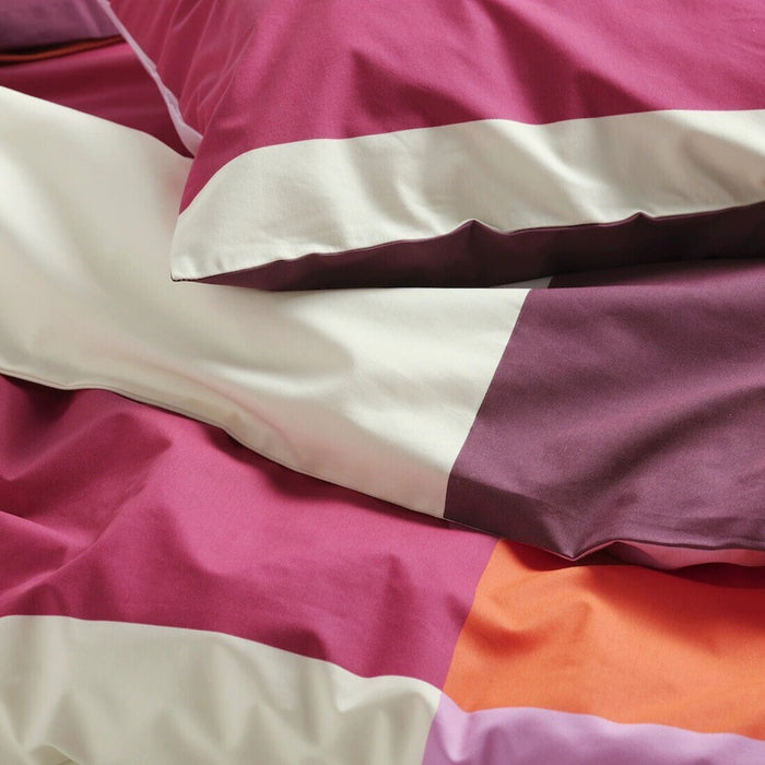 Close-up of IKEA BRUNKRISSLA pink bedding set with duvet cover and pillowcase