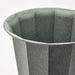 Close-up of IKEA BUSKVERK grey ribbed plant pot showing recycled material texture