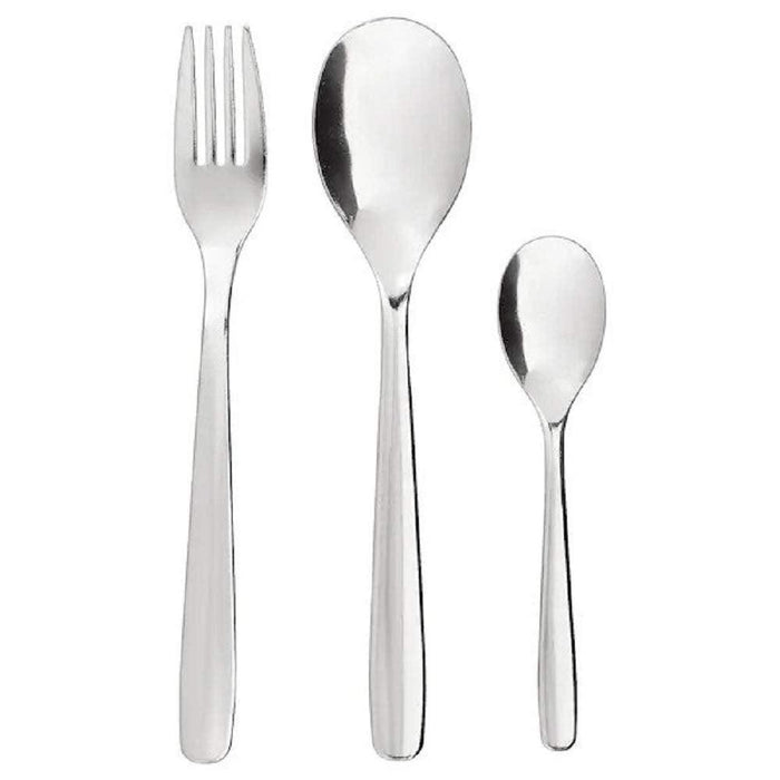 Set of silver cutlery including a fork, two spoons on a white background