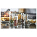 IKEA CITRONHAJ spice jars with colourful contents and stainless steel caps overhead view
