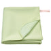 IKEA DAJLIEN Blanket in light green, folded neatly on a couch-00552732