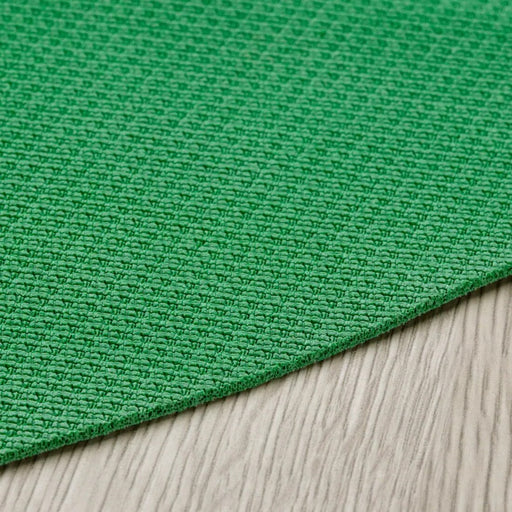 "Close-up of the IKEA DAJLIEN yoga mat's natural rubber surface."