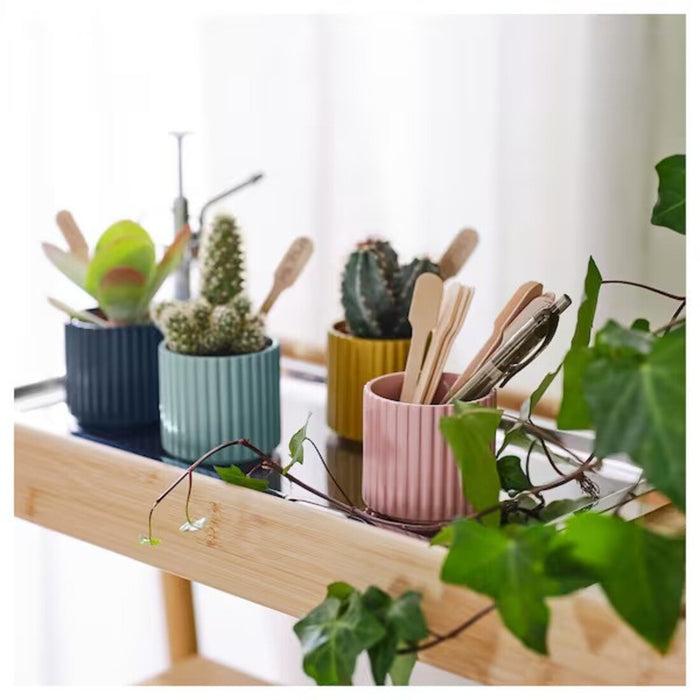 Multi-colored IKEA plant pot designed to complement any decor, adding a playful and charming element to your plant display-30567100