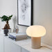 Serene bedroom with IKEA DEJSA chrome table lamp casting soft ambient light