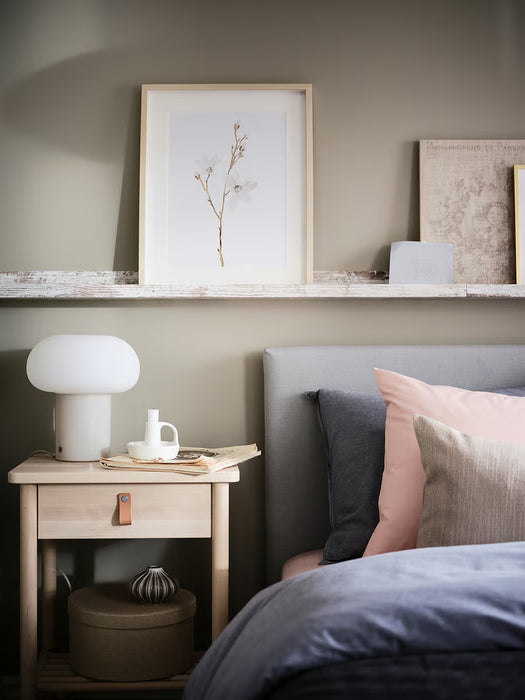 IKEA DEJSA lamp in modern minimalist room setup with beige chair and round side table