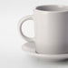  IKEA DINERA beige stoneware espresso cup and saucer on rustic table setting side angle