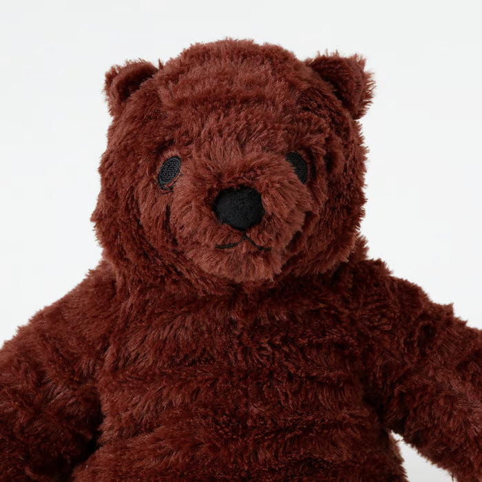 Close-up of IKEA DJUNGELSKOG bear cub showing embroidered safe eyes and soft snout detail