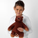 IKEA DJUNGELSKOG small brown bear cub being held to show 32cm scale for kids and travel