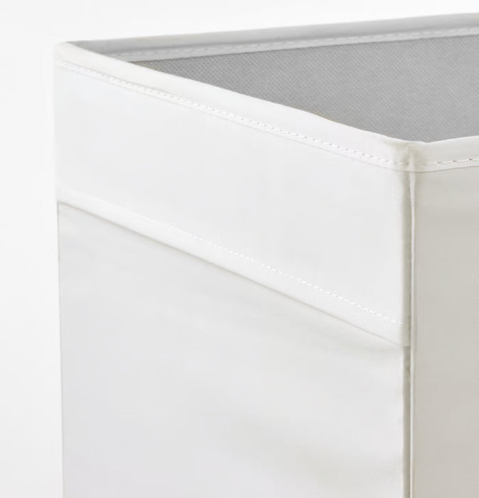 Close-up corner of IKEA DRÖNA white fabric box showing neat stitching and sturdy construction