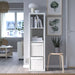 IKEA DRÖNA white box placed inside KALLAX shelf unit in a modern living room with plant and wall art