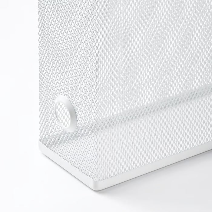 Close-up of IKEA DRÖNJÖNS metal mesh texture and protective pads on the bottom surface