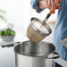 IKEA DVÄRGKRÄFTA stainless steel pots with lids and handles arranged together