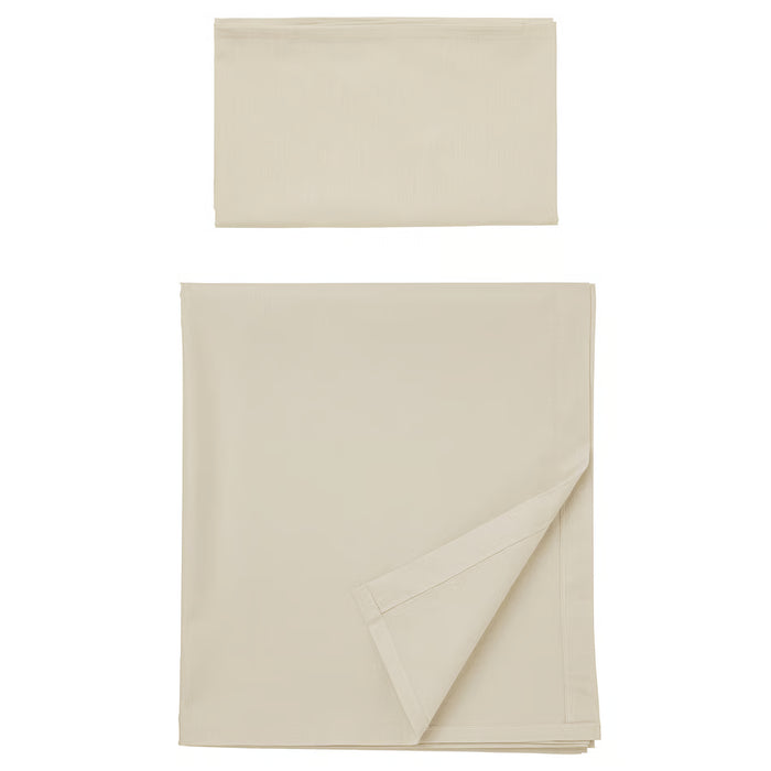 IKEA DVALA cotton flat sheet and pillowcase set in beige, folded and stacked #40627778
