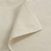 Close-up of IKEA DVALA beige cotton fabric showing fine woven stitching detail