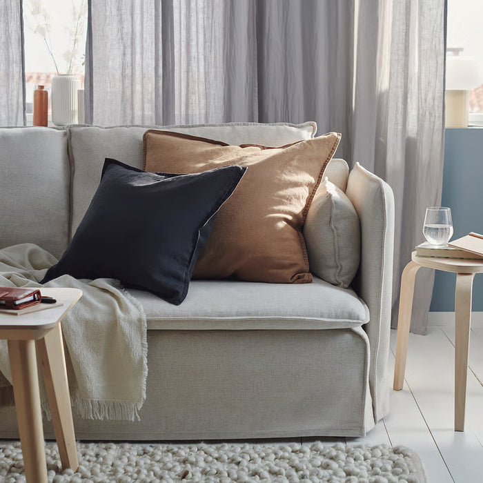 IKEA DYTÅG dark beige cushion cover styled on grey sofa in living room