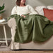 "Elegant IKEA decorative throw on a comfortable armchair-30554150
