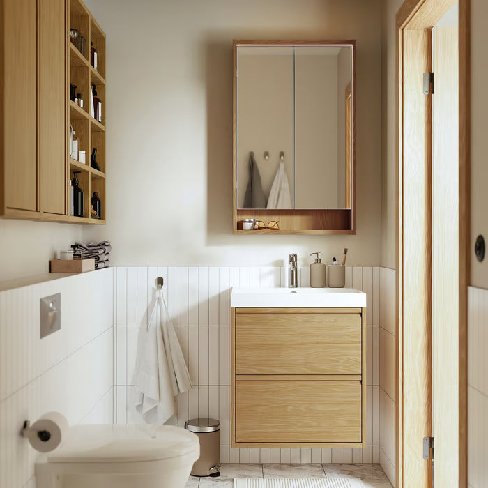 IKEA EKOLN beige soap dispenser top-down view showing pump and glazed finish