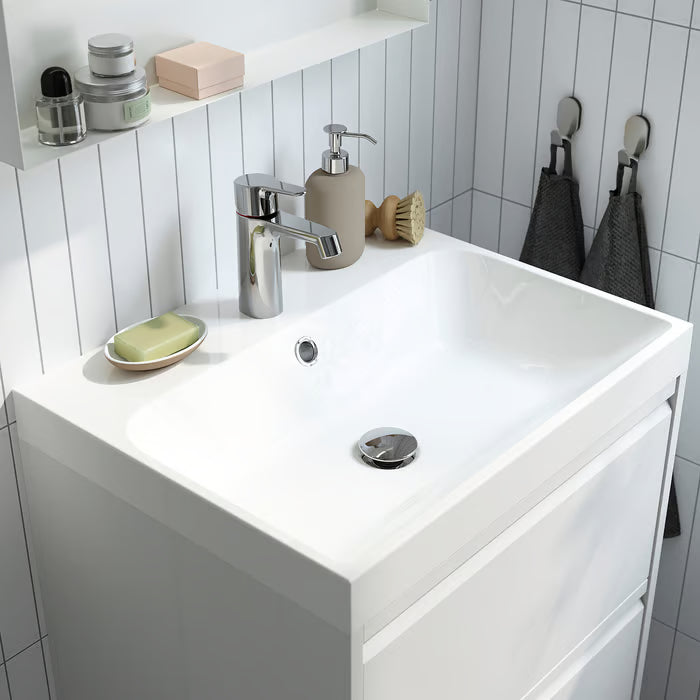 IKEA EKOLN soap dispenser beige close-up showing smooth curved stoneware body and pump detail