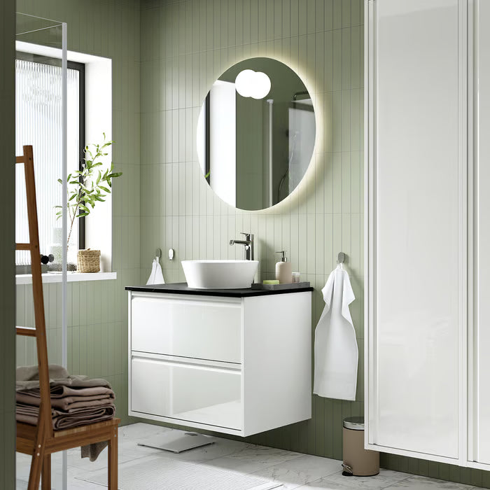 IKEA EKOLN beige soap dispenser on bathroom shelf styled in a minimal bathroom setting